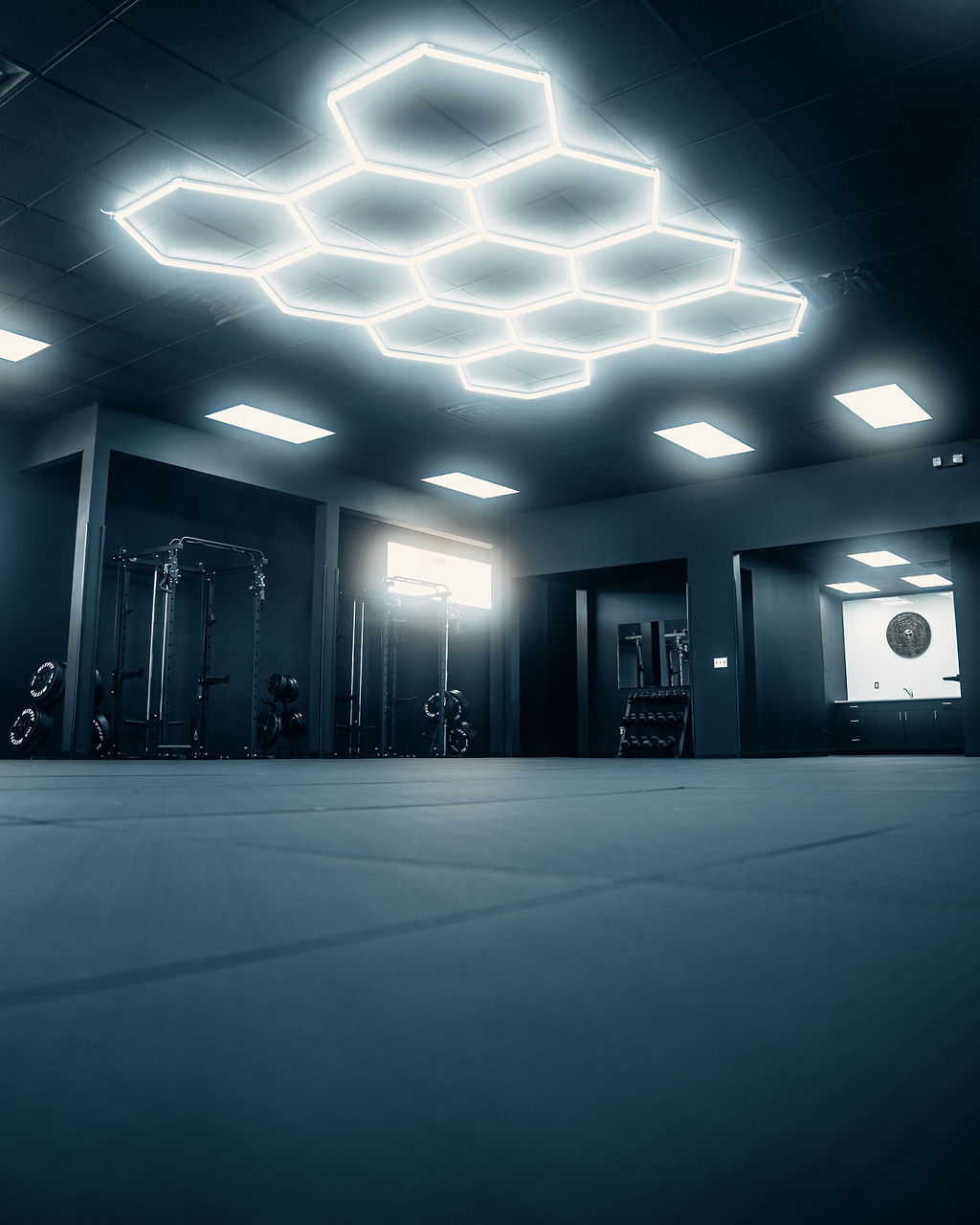 Open Grindstone mat space beneath geometric ceiling lights