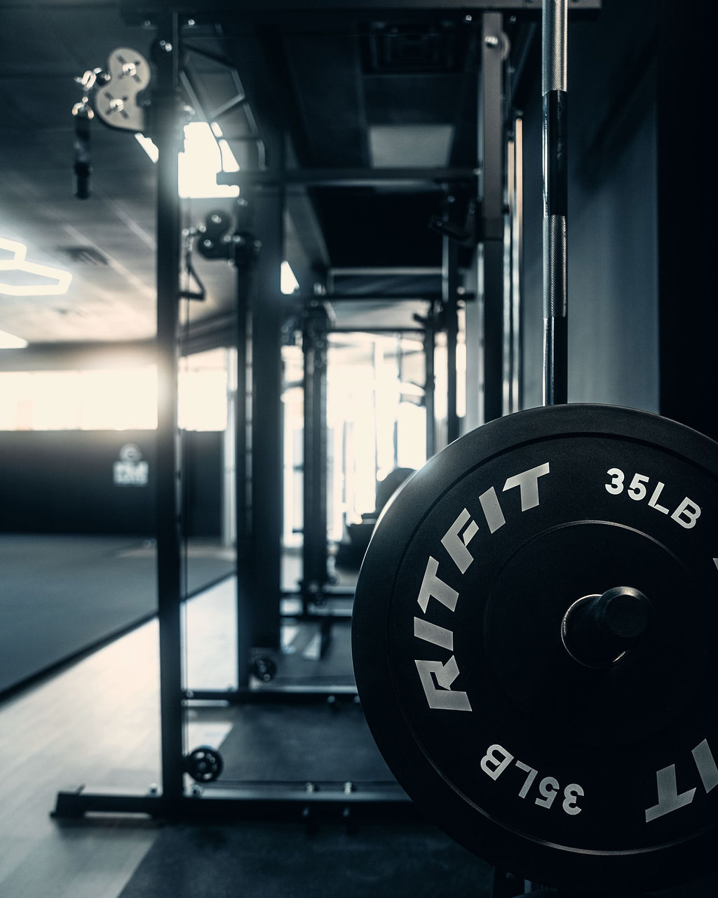 Strength rack with a weight plate inside the Grindstone facility