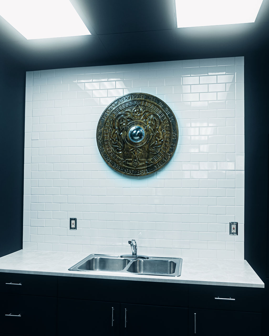 Utility counter with a decorative shield at Grindstone